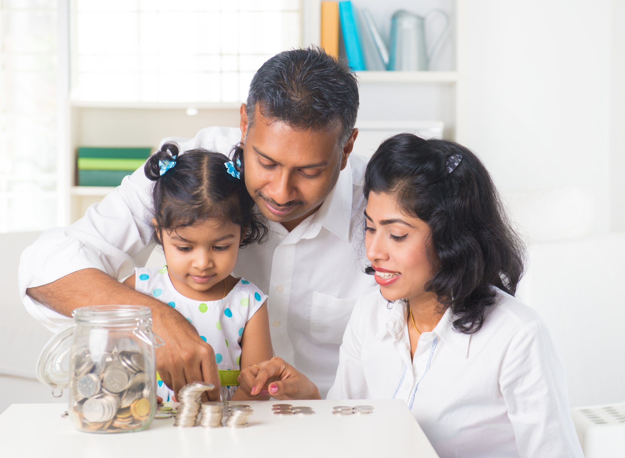 Indian family with child money jars